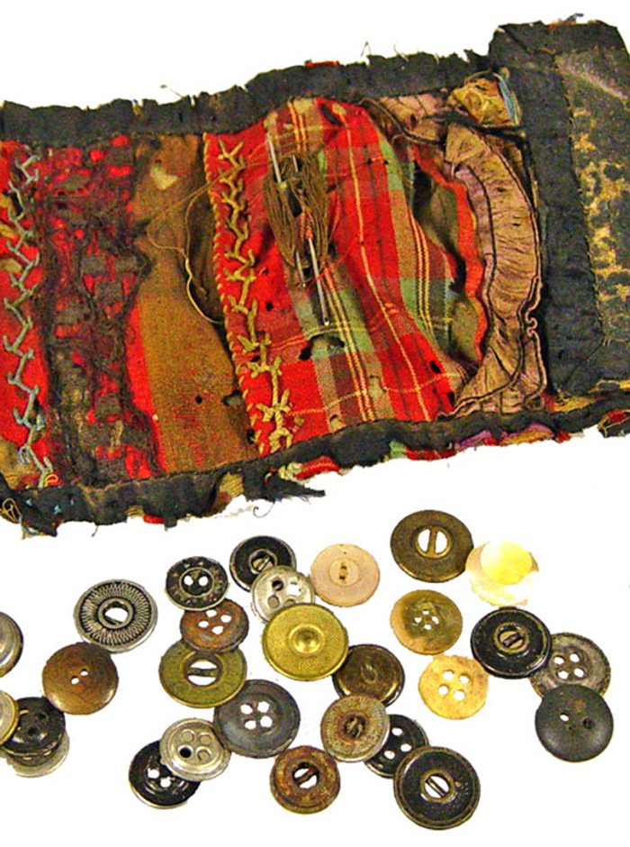 An old travelling sewing kit with needles and thread