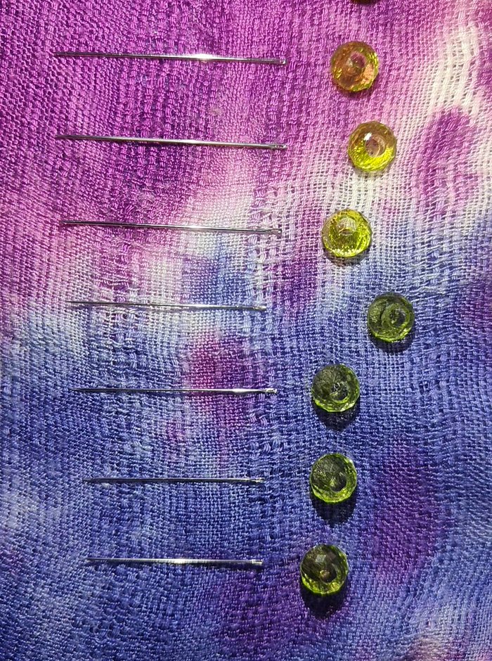 Sewing needles laid out in order of size