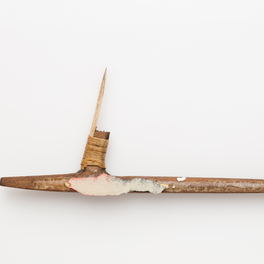 Studio detail: a carved uhi chisel laid flat on a white ground.