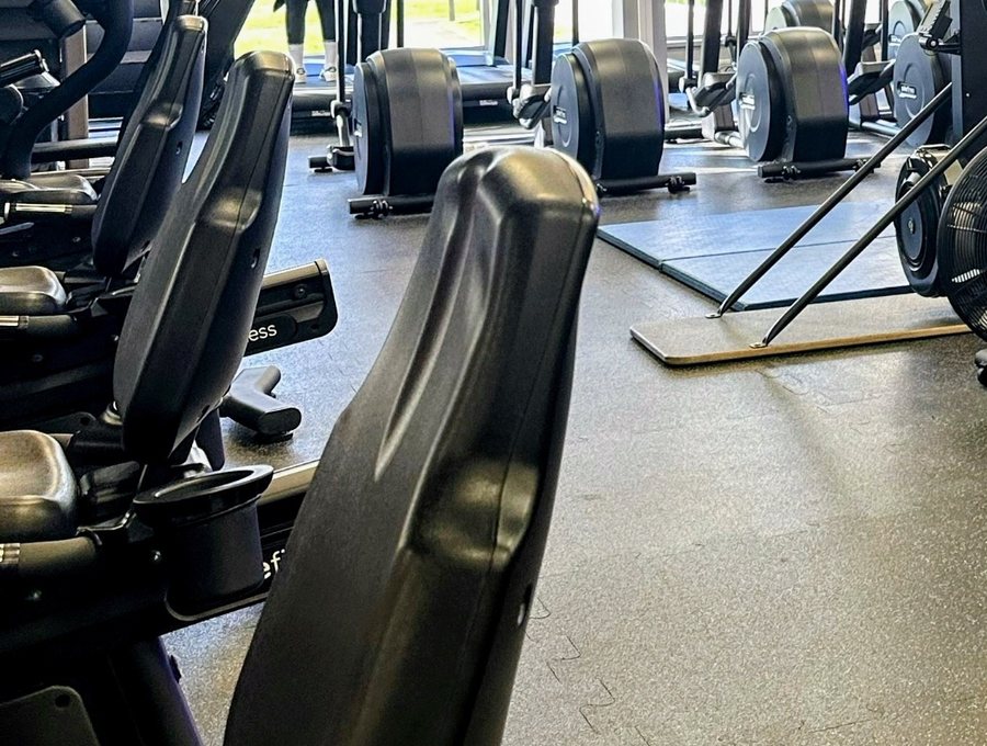 Cardio and resistance machines on the clinic's rehabilitation gym floor