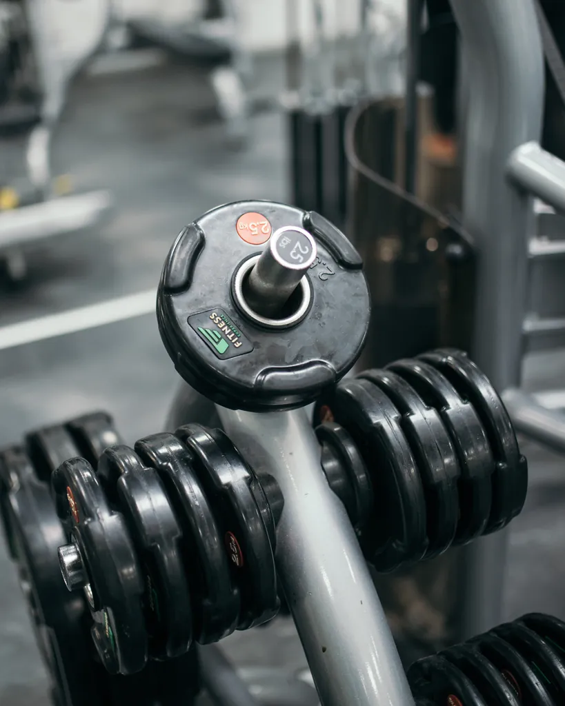 Graded dumbbells arranged on a rack