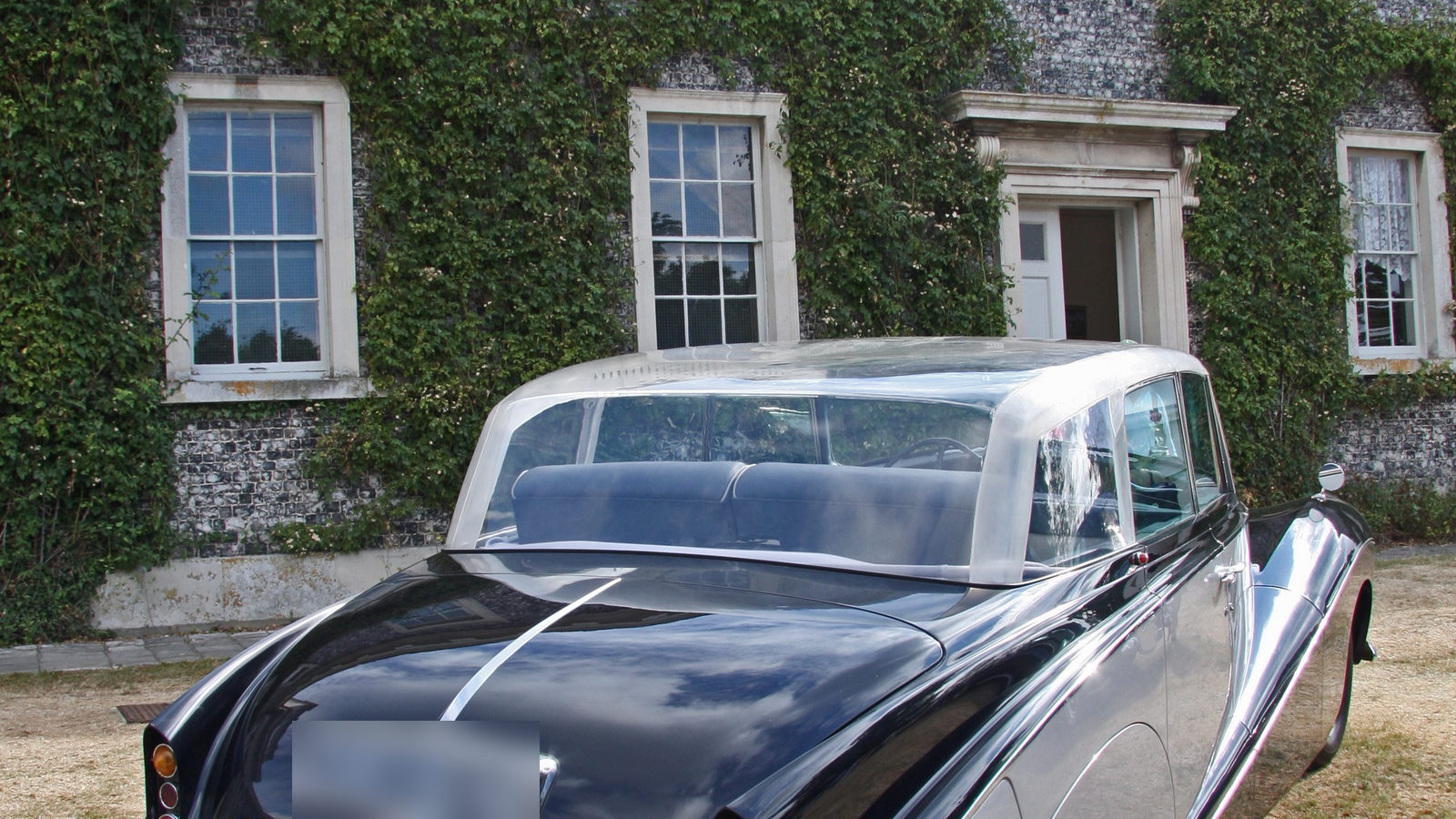 A 1956 Rolls-Royce Silver Wraith, rear three-quarter