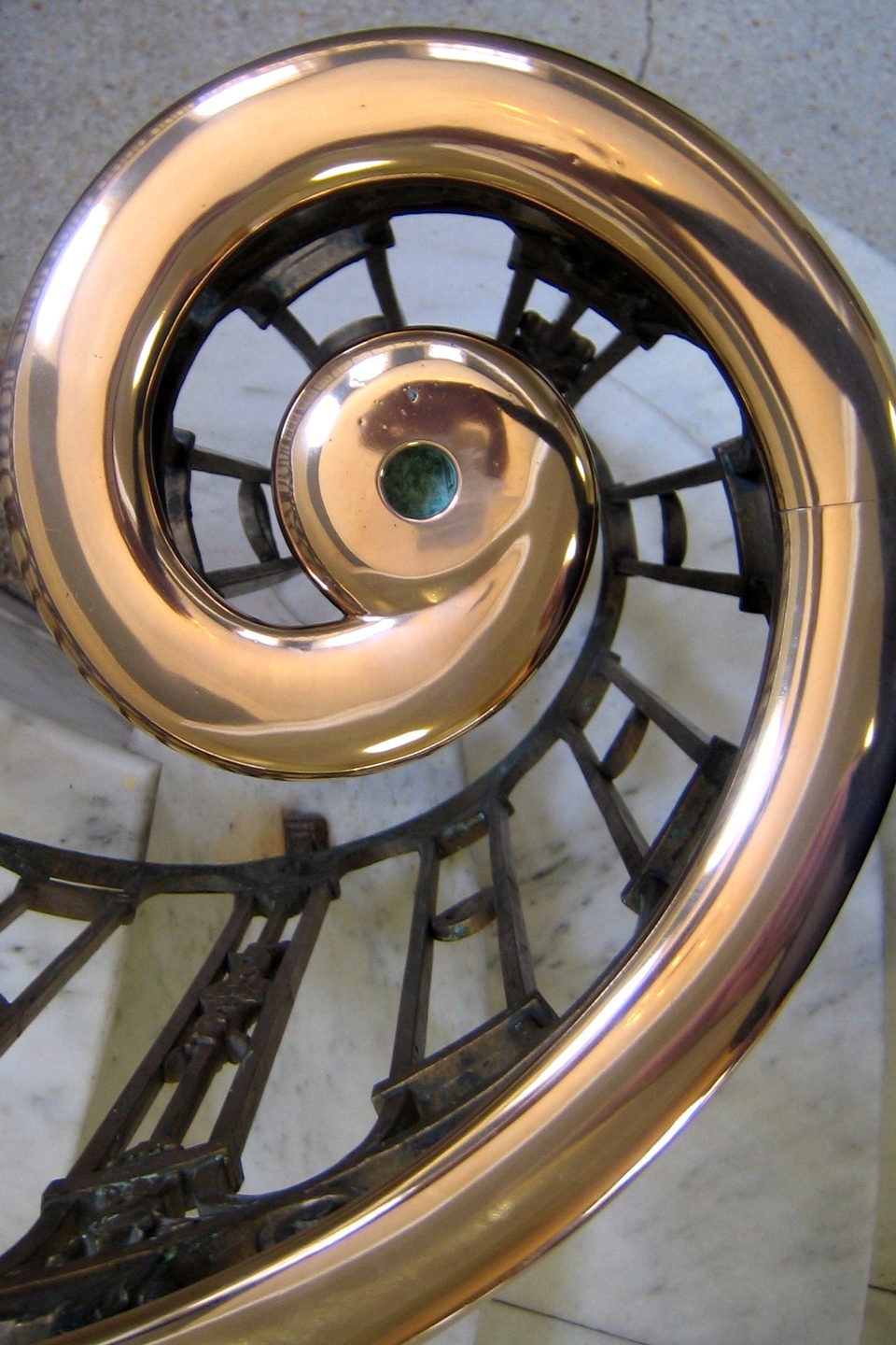 Sweeping sculpted marble staircase in a grand interior