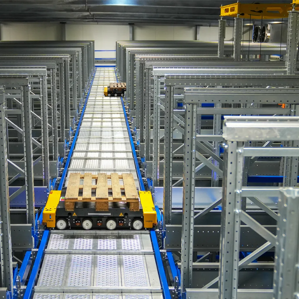 Racked storage bays beside a clear central retrieval aisle