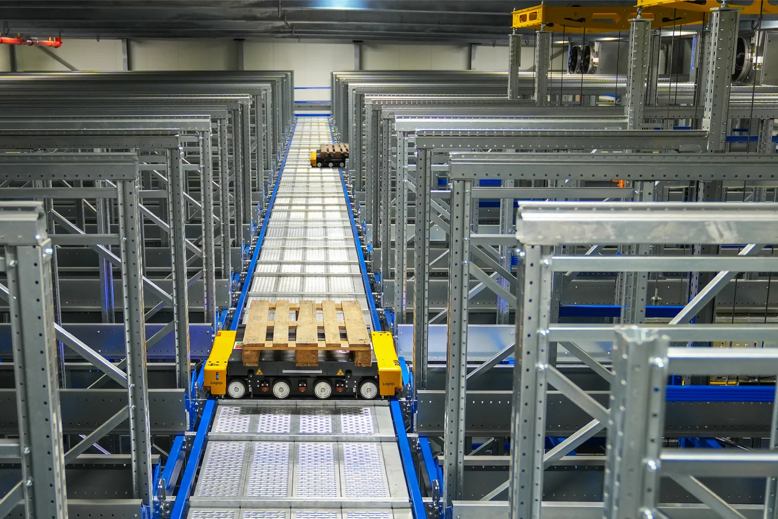 Racked storage bays with a clear retrieval aisle