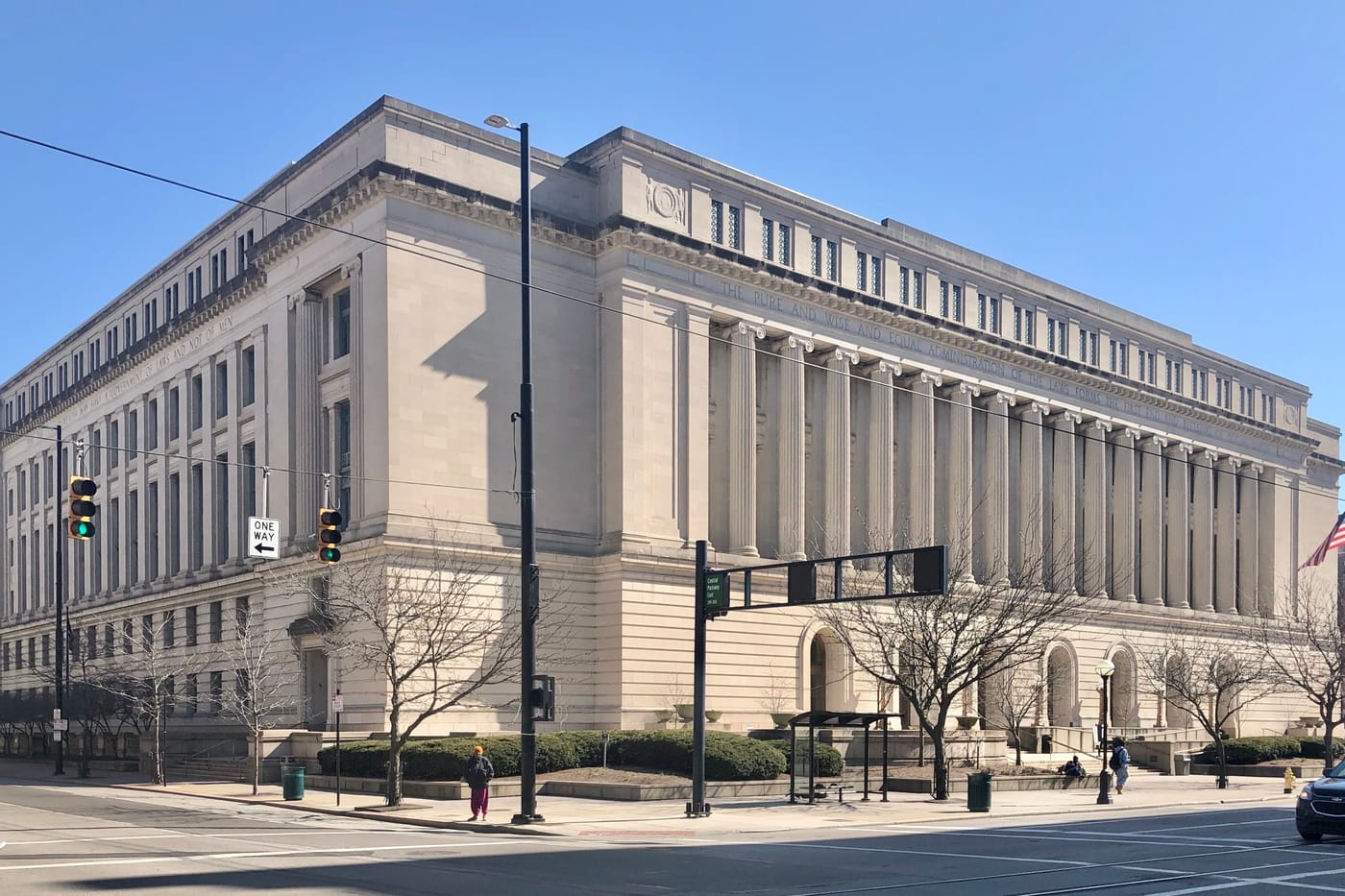 The long stone front of the county courthouse in Cincinnati seen from a street corner.