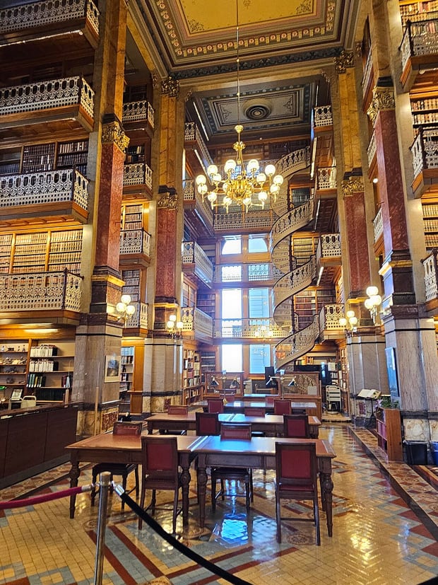 A tall bay of law library shelving, lit from a window out of frame.
